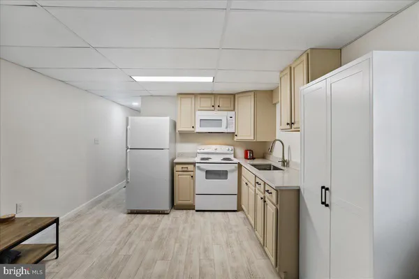 a kitchen with cabinets and stainless steel appliances