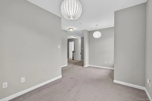 en view of an empty room and a gallery