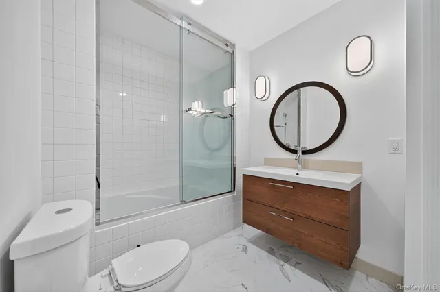a bathroom with a toilet a sink and a bathtub