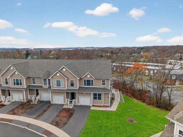 a aerial view of a house with a yard