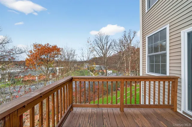 a view of a balcony with wooden floor