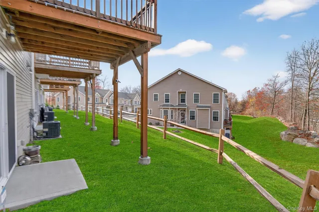 a view of house with a yard