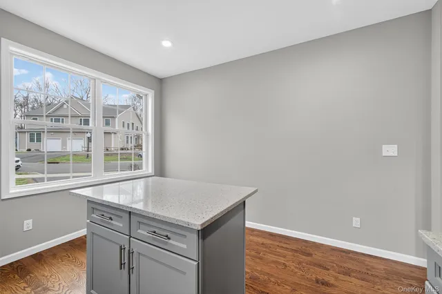a view of washer and dryer with bathroom in the background