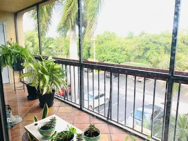 a view of balcony with furniture