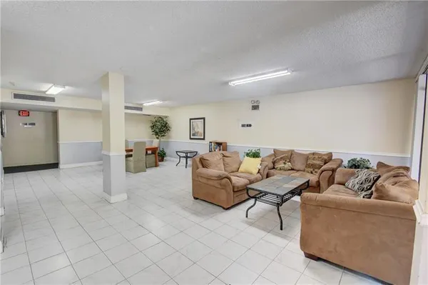 a living room with furniture and a table