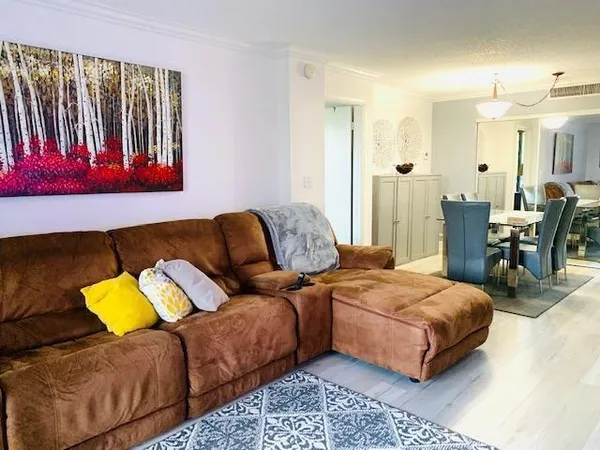 a living room with a bed and a couch