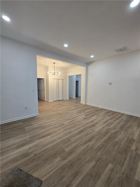 4645 Gordon Street Fairburn, GA 30213 - Photo 13 of 17 an empty room with wooden floor and windows