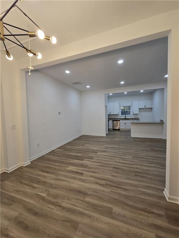 4645 Gordon Street Fairburn, GA 30213 - Photo 14 of 17 a view of kitchen and kitchen with stainless steel appliances wooden floor