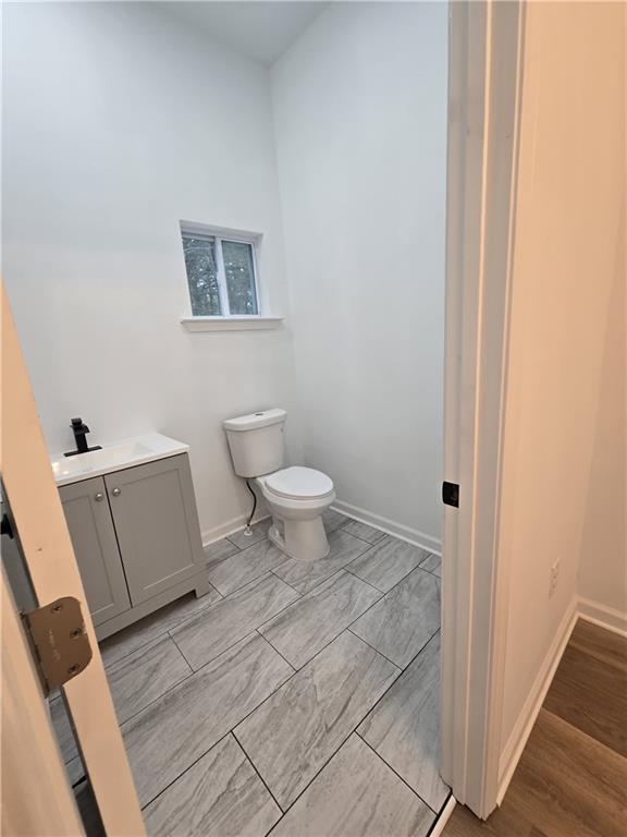 4645 Gordon Street Fairburn, GA 30213 - Photo 15 of 17 a bathroom with a toilet and a sink