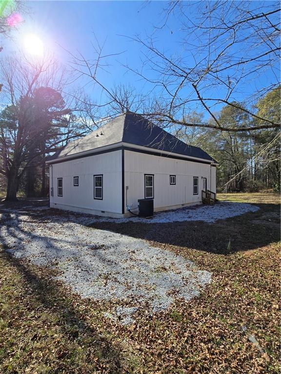 4645 Gordon Street Fairburn, GA 30213 - Photo 4 of 17 a house view with a backyard
