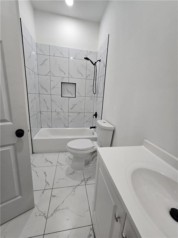 4645 Gordon Street Fairburn, GA 30213 - Photo 6 of 17 a bathroom with a sink a toilet and shower