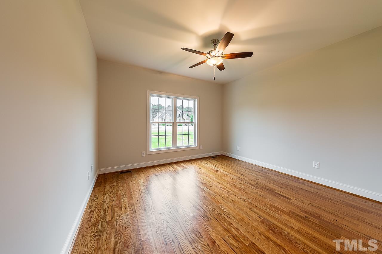 L9 Harvest Rdg Road Battleboro, NC 27809 - Photo 6 of 18 a view of empty room with wooden floor and fan