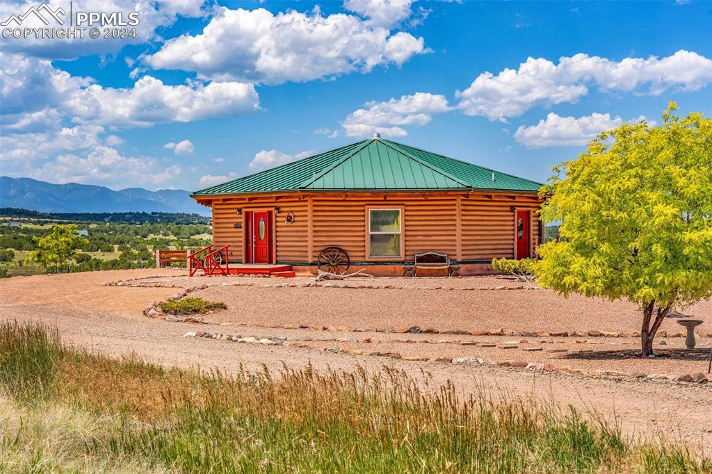 1747 Newton Road Pueblo, CO 81005 - Photo 1 of 50 a front view of a house with a yard and garage