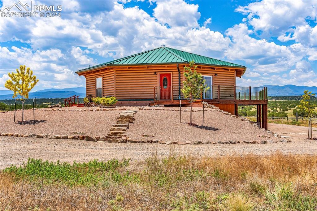 1747 Newton Road Pueblo, CO 81005 - Photo 2 of 50 a backyard of a house with a yard and outdoor seating