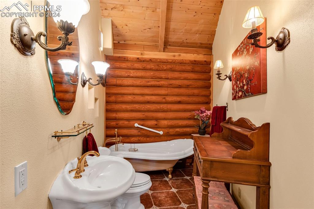 1747 Newton Road Pueblo, CO 81005 - Photo 22 of 50 a bathroom with a sink a mirror and a toilet