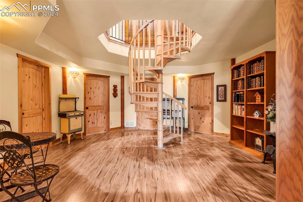 1747 Newton Road Pueblo, CO 81005 - Photo 26 of 50 a view of empty room with wooden floor and cabinet