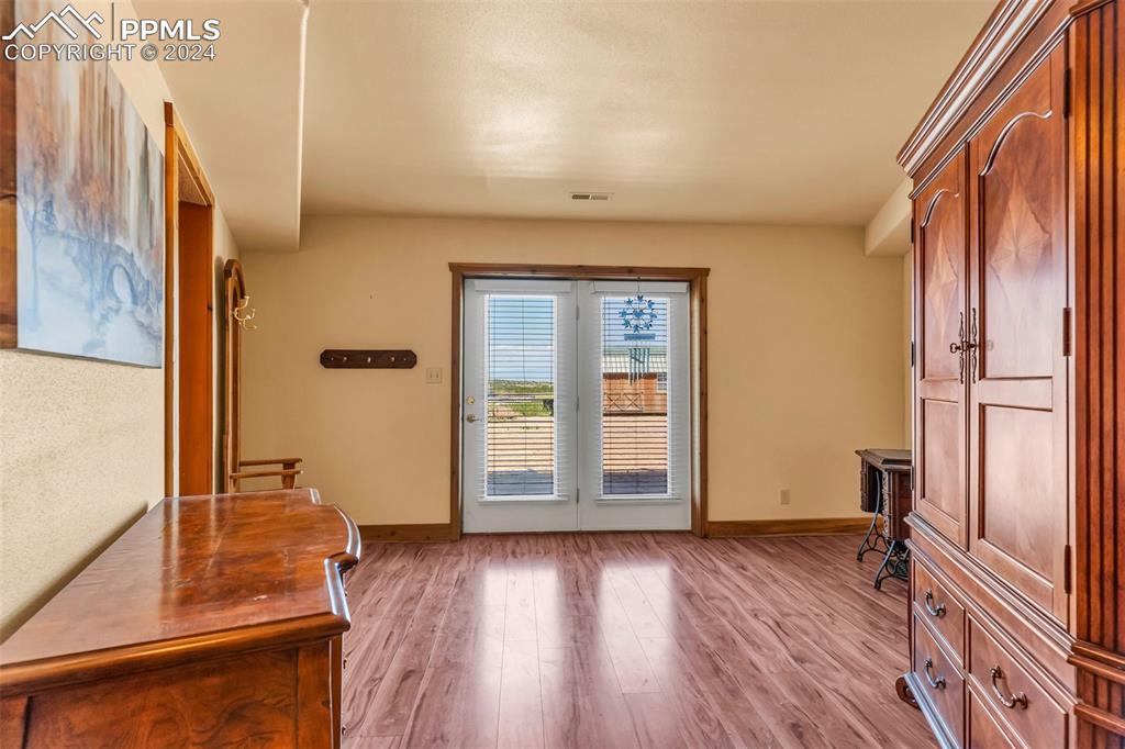 1747 Newton Road Pueblo, CO 81005 - Photo 28 of 50 a view of front door with wooden floor
