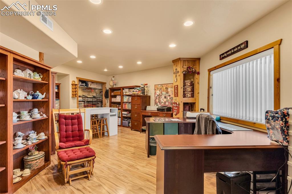 1747 Newton Road Pueblo, CO 81005 - Photo 33 of 50 a living room with lots of furniture and clutter