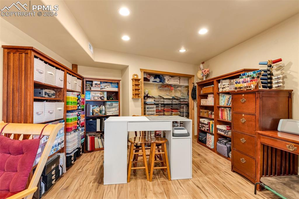 1747 Newton Road Pueblo, CO 81005 - Photo 34 of 50 a view of a play room with furniture and wooden floor