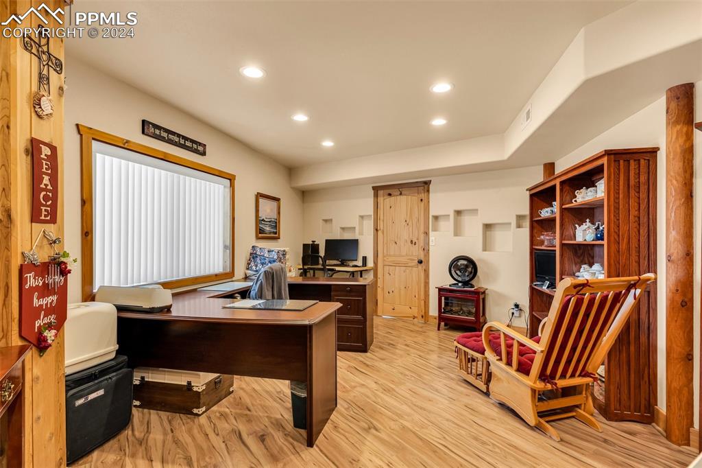 1747 Newton Road Pueblo, CO 81005 - Photo 35 of 50 a view of a workspace with furniture and a window
