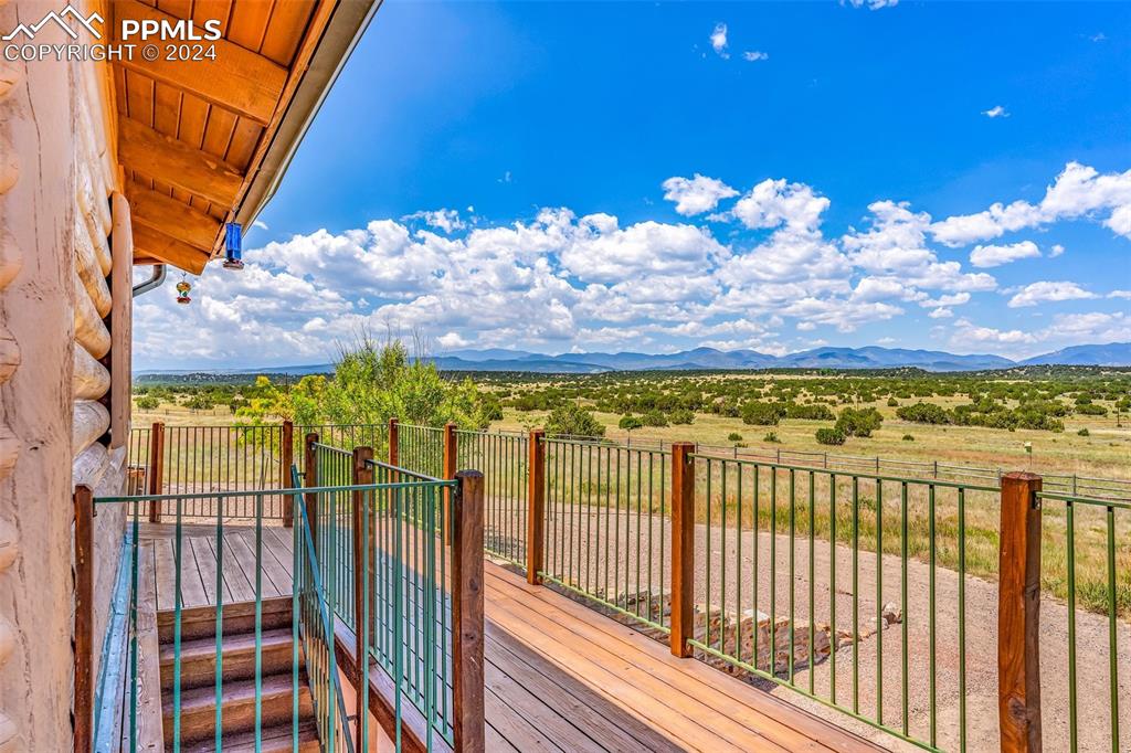 1747 Newton Road Pueblo, CO 81005 - Photo 38 of 50 a view of a balcony with wooden floor and a city view