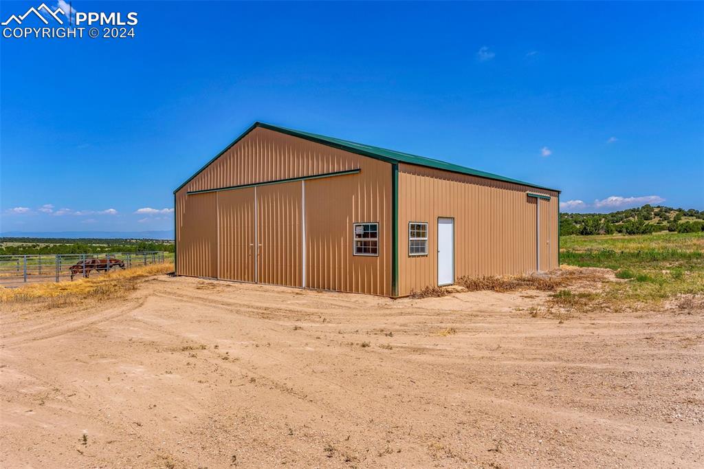 1747 Newton Road Pueblo, CO 81005 - Photo 43 of 50 a view of large house with a yard