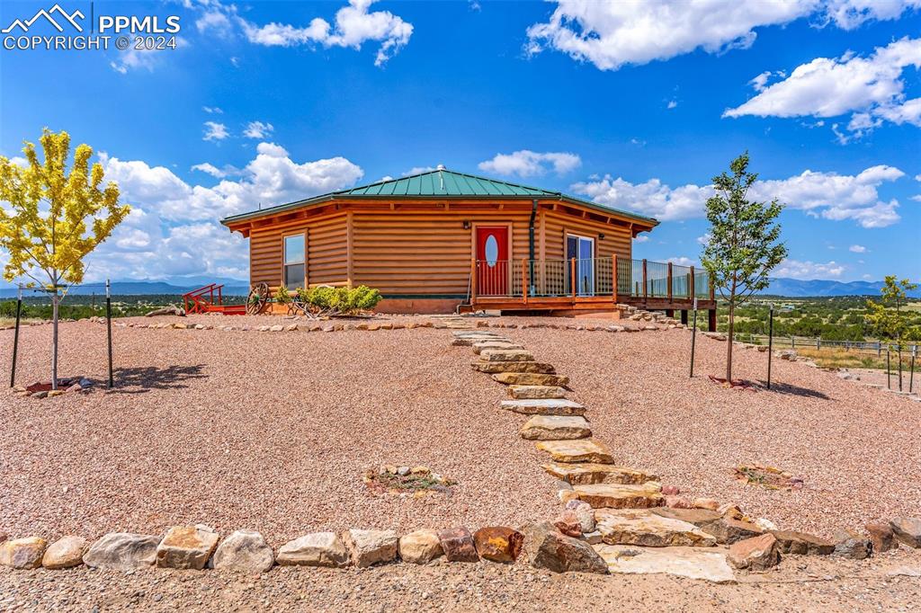 1747 Newton Road Pueblo, CO 81005 - Photo 5 of 50 a backyard of a house with table and chairs