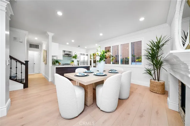 a kitchen with granite countertop a refrigerator and a stove top oven