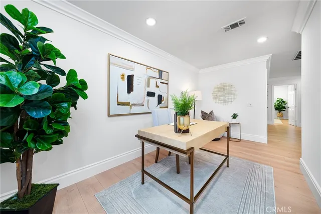a bedroom with a large bed and a book shelf