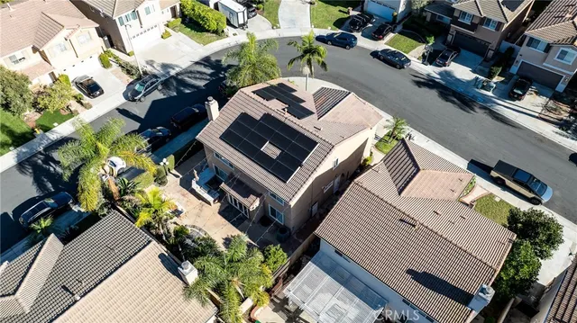 an aerial view of a house with outdoor space