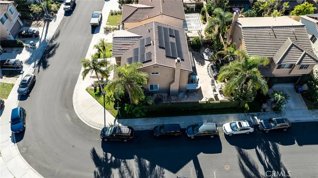 an aerial view of a house with a yard