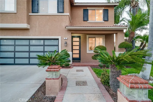 a house with potted plants in front of it