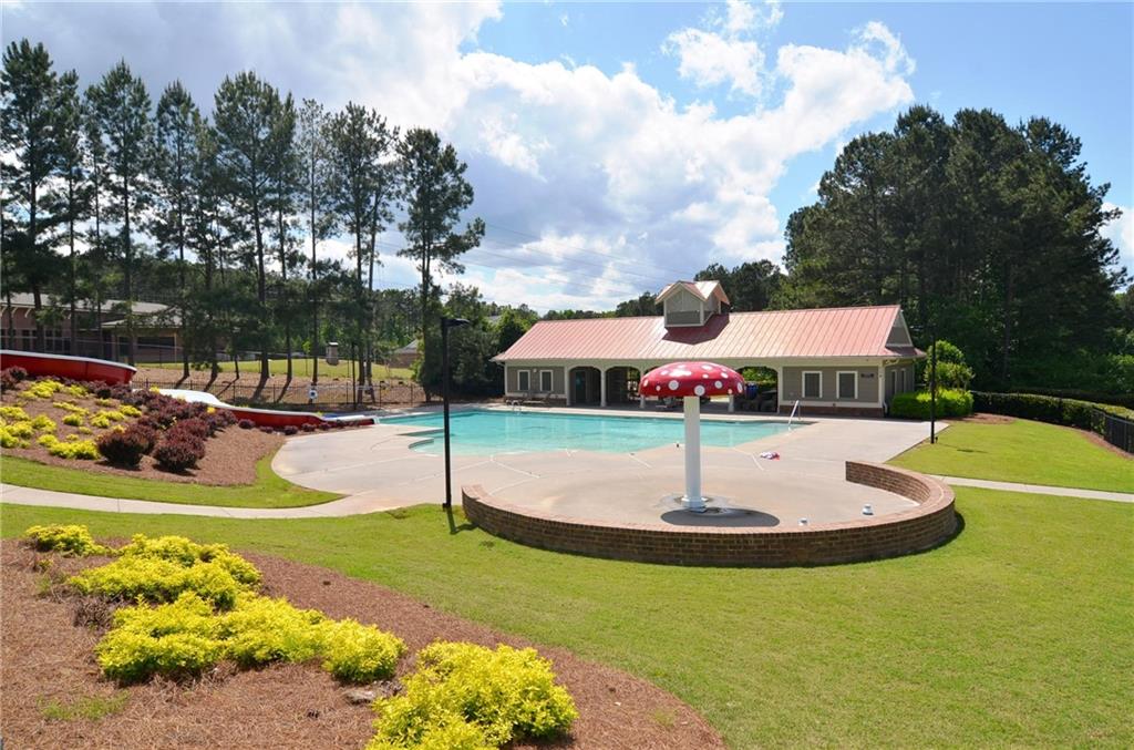 43 Ivy Mist Lane Acworth, GA 30101 - Photo 58 of 58 a swimming pool with some trees in the background