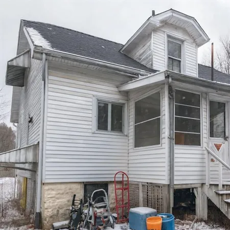 a front view of a house with balcony