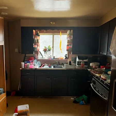 a room with furniture a window and a sink