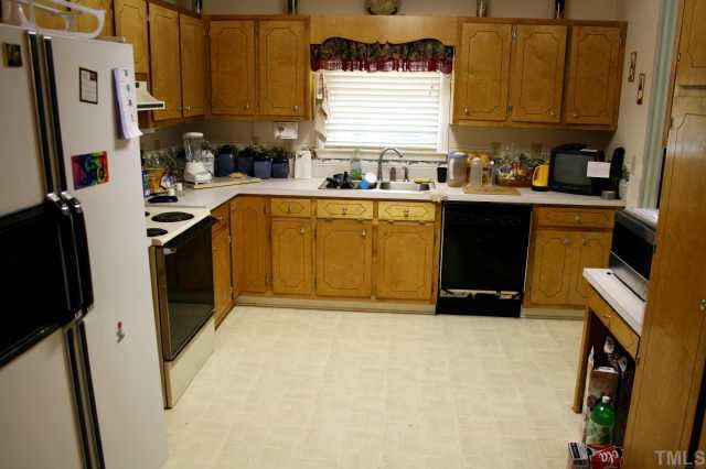 4 Orion Circle Rougemont, NC 27572 - Photo 3 of 8 a kitchen with stainless steel appliances a sink a stove a refrigerator a window