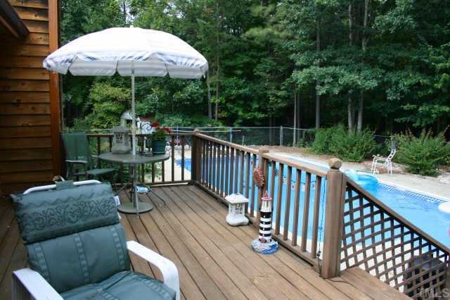 4 Orion Circle Rougemont, NC 27572 - Photo 4 of 8 a view of a deck with furniture and a backyard