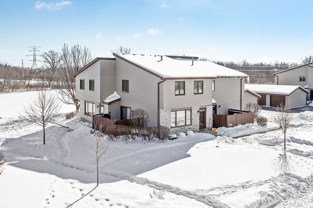 304 Circlegate Road, Unit 304 New Lenox, IL 60451 - Photo 1 of 1 a view of a white house