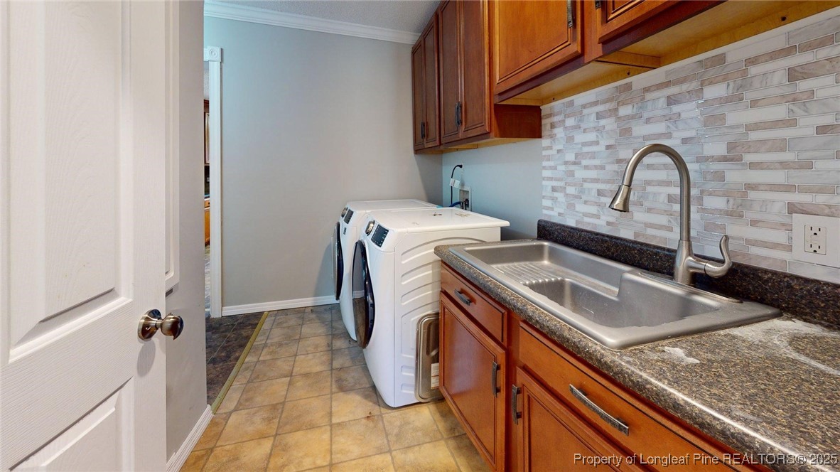 120 Mockingbird Lane Spring Lake, NC 28390 - Photo 17 of 23 a utility room with dryer and washer