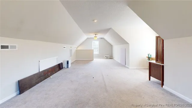 a view of a hallway view with staircase