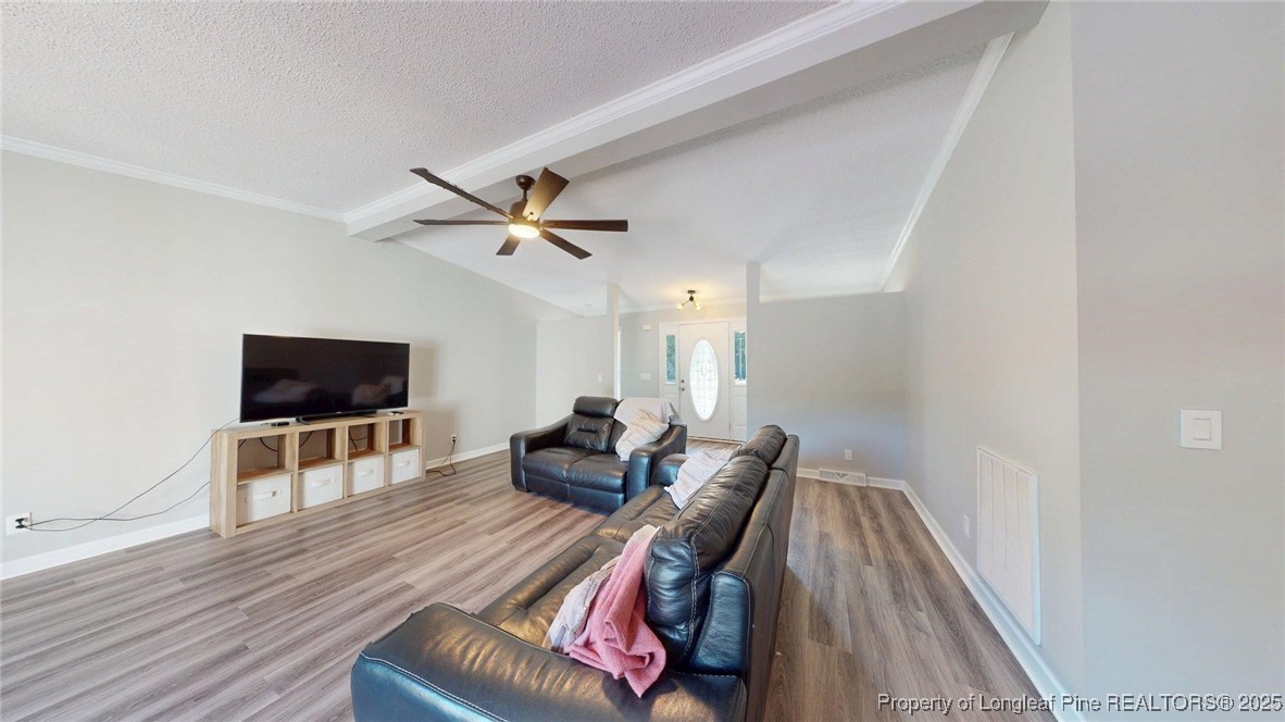 120 Mockingbird Lane Spring Lake, NC 28390 - Photo 6 of 23 a living room with furniture and a flat screen tv