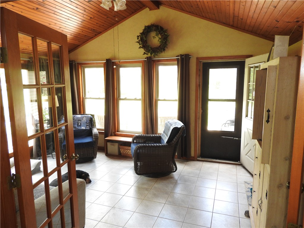 2185 East Loy Road Piqua, OH 45356 - Photo 4 of 19 This bright sunroom offers an inviting space for relaxation with abundant natural light.