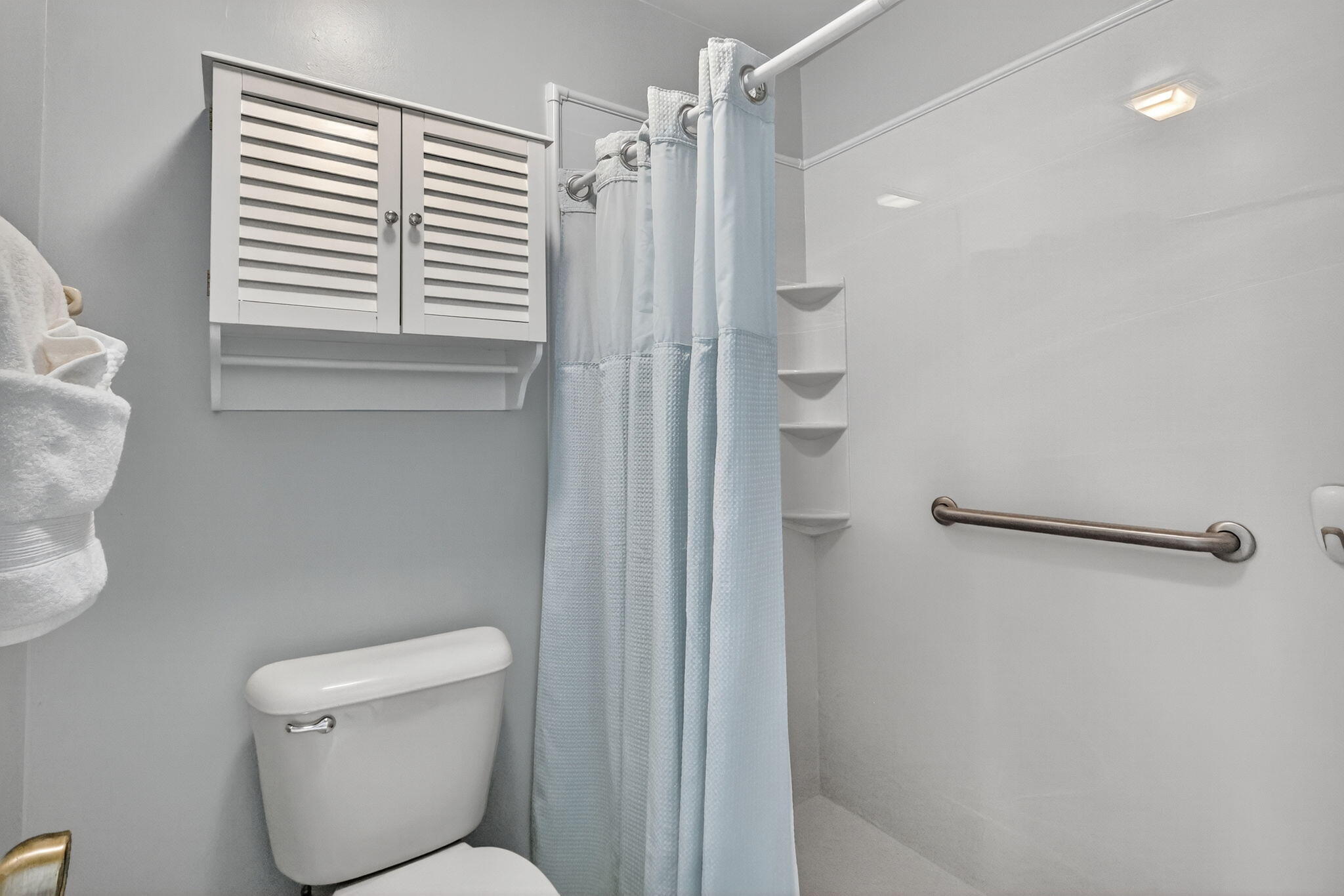 7643 Southeast Sugar Sand Circle Hobe Sound, FL 33455 - Photo 14 of 44 a bathroom with a toilet and a shower