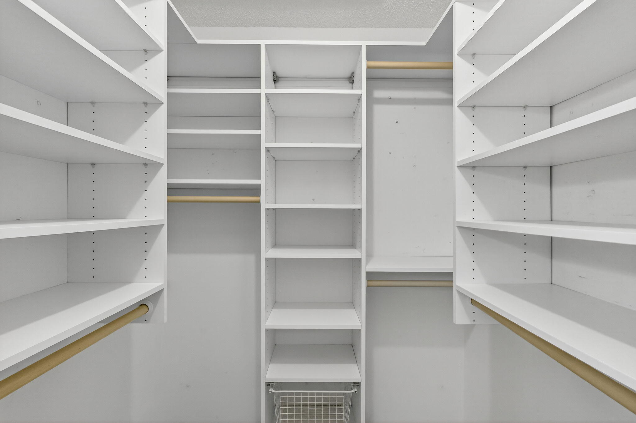 7643 Southeast Sugar Sand Circle Hobe Sound, FL 33455 - Photo 15 of 44 a view of walk in closet with empty racks