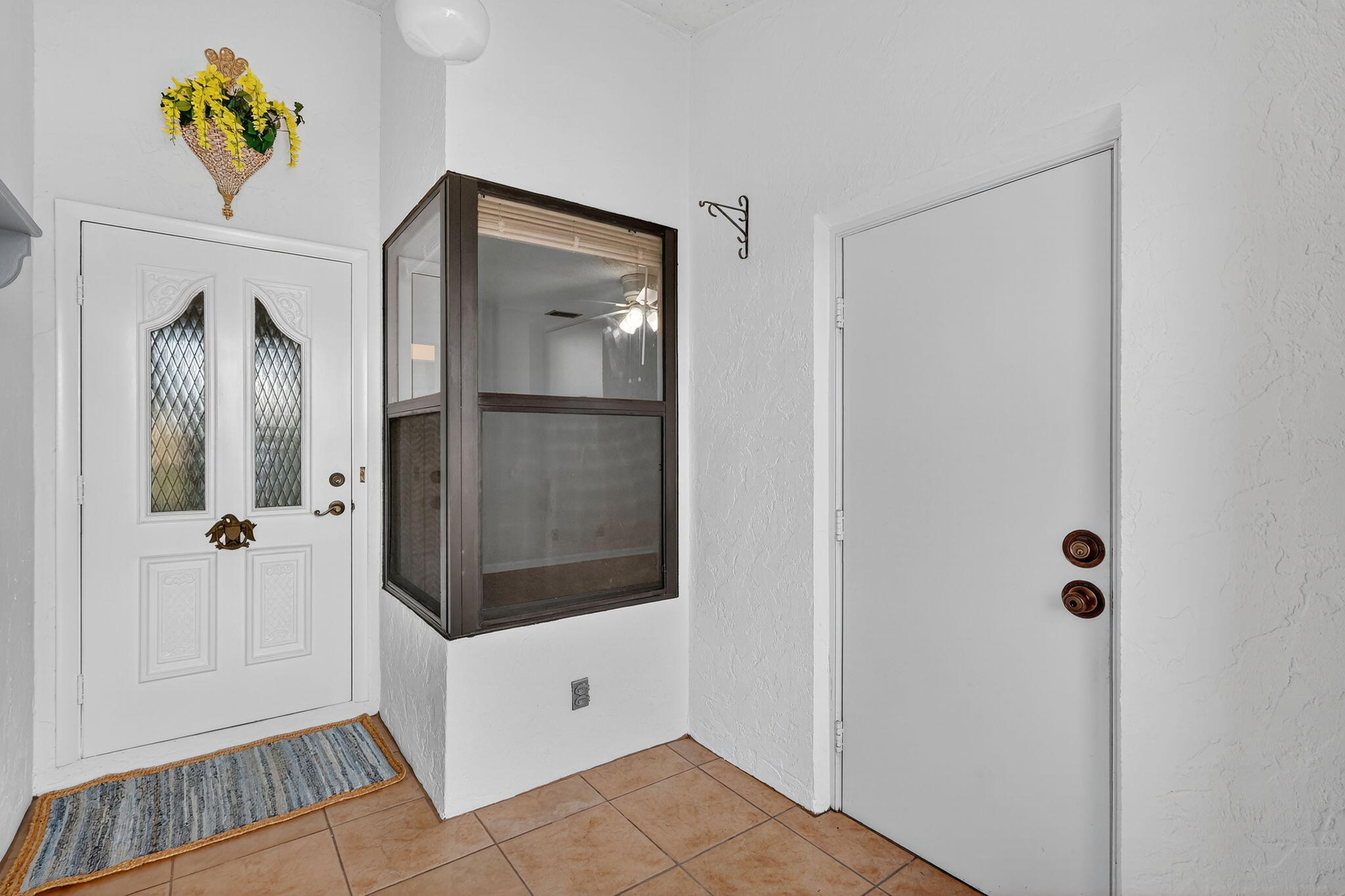 7643 Southeast Sugar Sand Circle Hobe Sound, FL 33455 - Photo 24 of 44 a bathroom with a shower and mirror