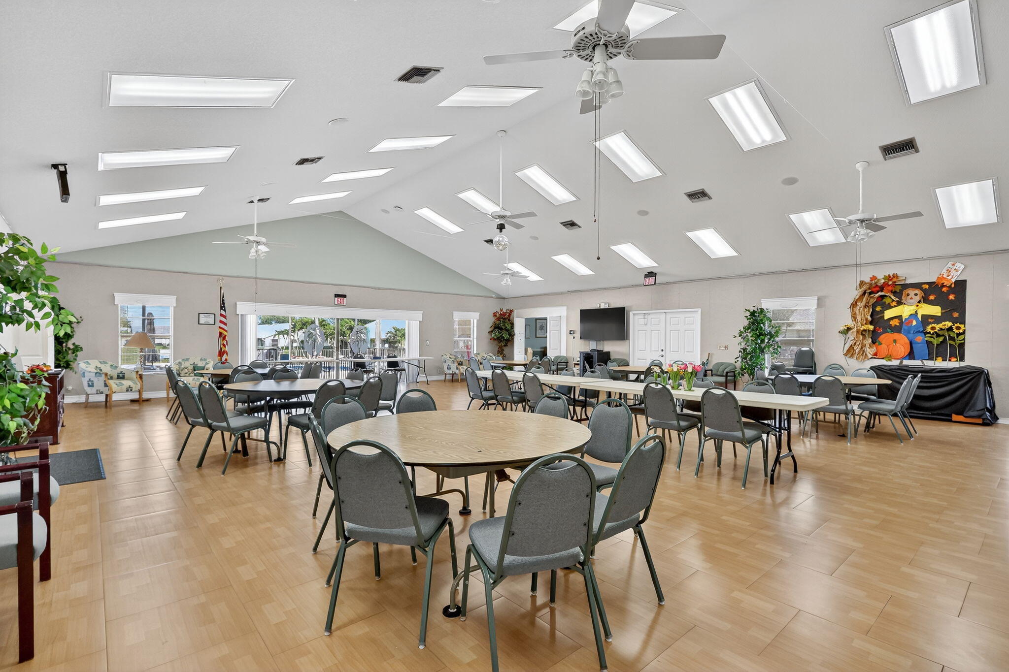 7643 Southeast Sugar Sand Circle Hobe Sound, FL 33455 - Photo 25 of 44 a view of a dining room with furniture and wooden floor