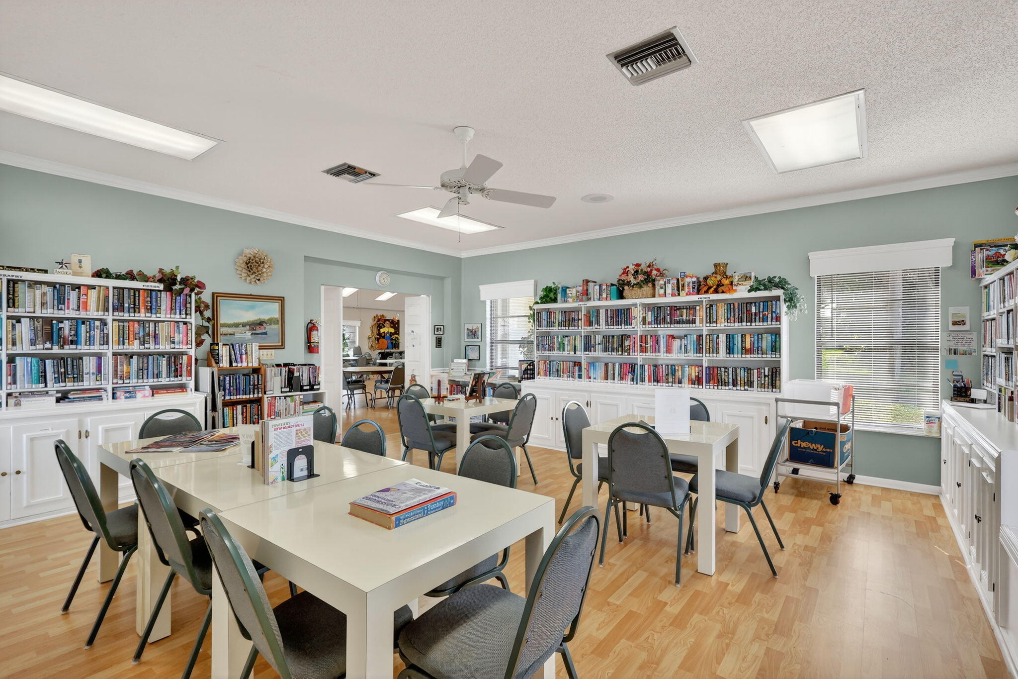 7643 Southeast Sugar Sand Circle Hobe Sound, FL 33455 - Photo 28 of 44 a view of a dining room with furniture and wooden floor