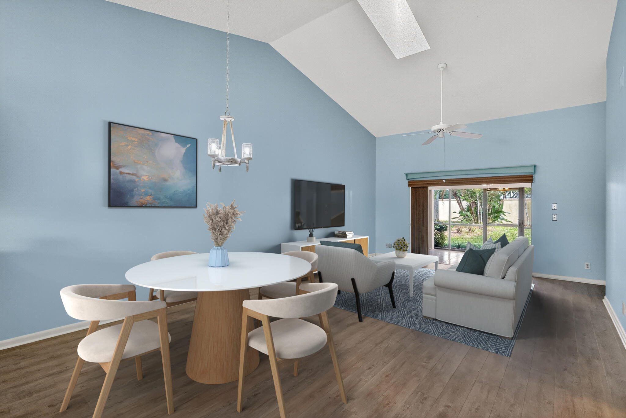 7643 Southeast Sugar Sand Circle Hobe Sound, FL 33455 - Photo 4 of 44 a living room with furniture a flat screen tv and a large window