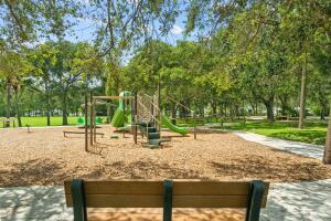 7643 Southeast Sugar Sand Circle Hobe Sound, FL 33455 - Photo 41 of 44 a view of a yard with trees