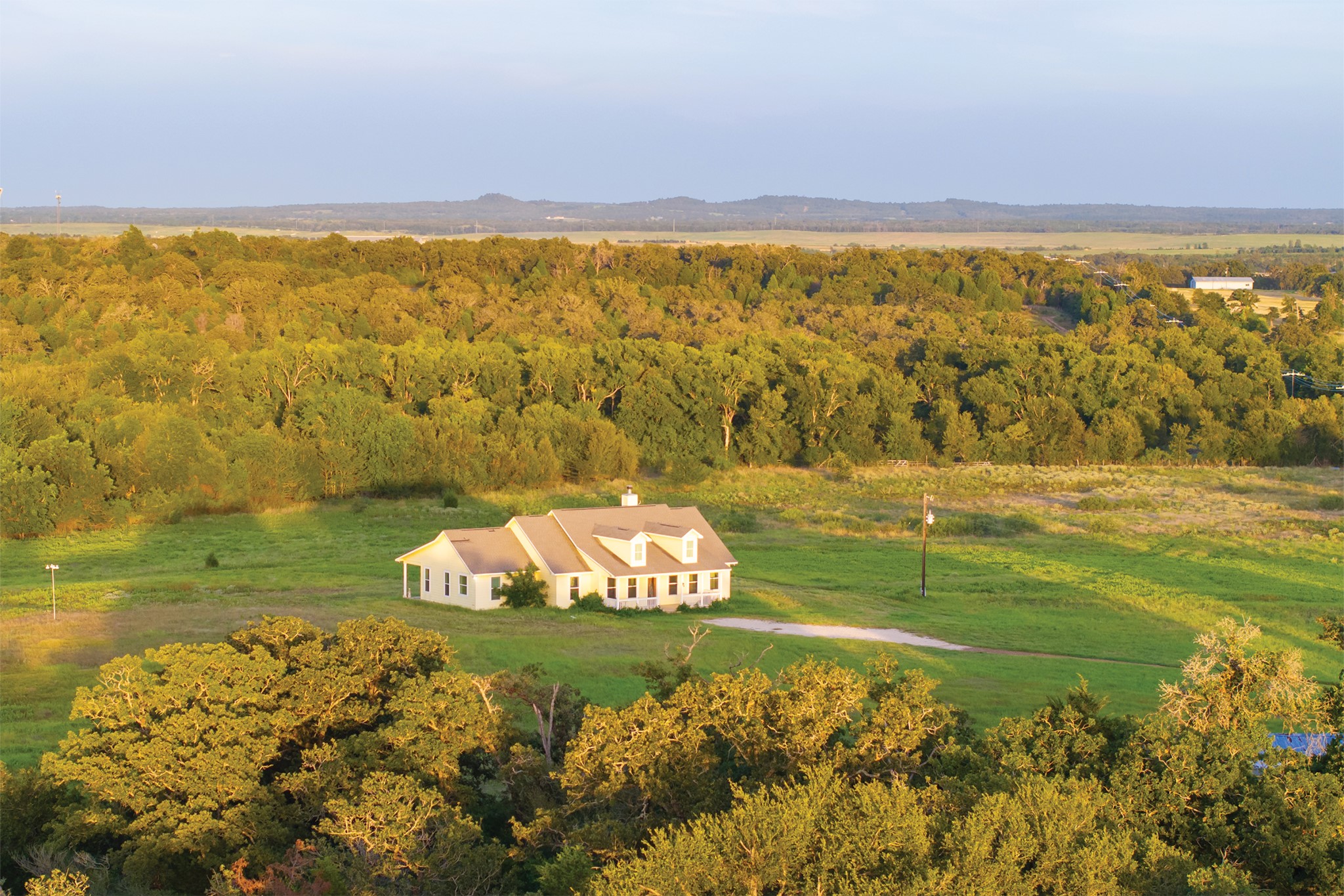 498 North County Line Road Elgin, TX 78621 - Photo 23 of 40 View from above of property featuring a forest